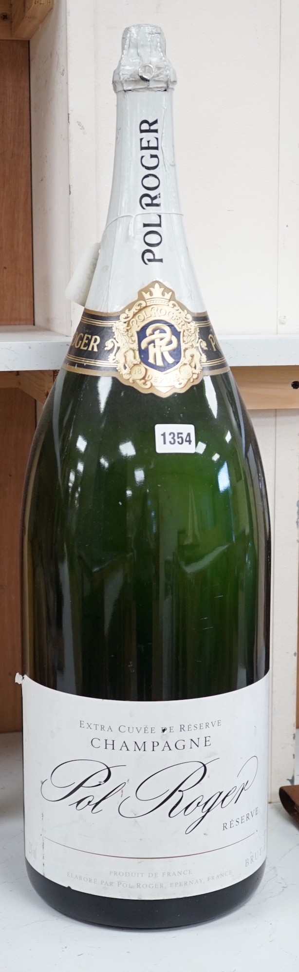 A vacant Nebuchadnezzar bottle of Pol Roger reserve champagne, 72cm high